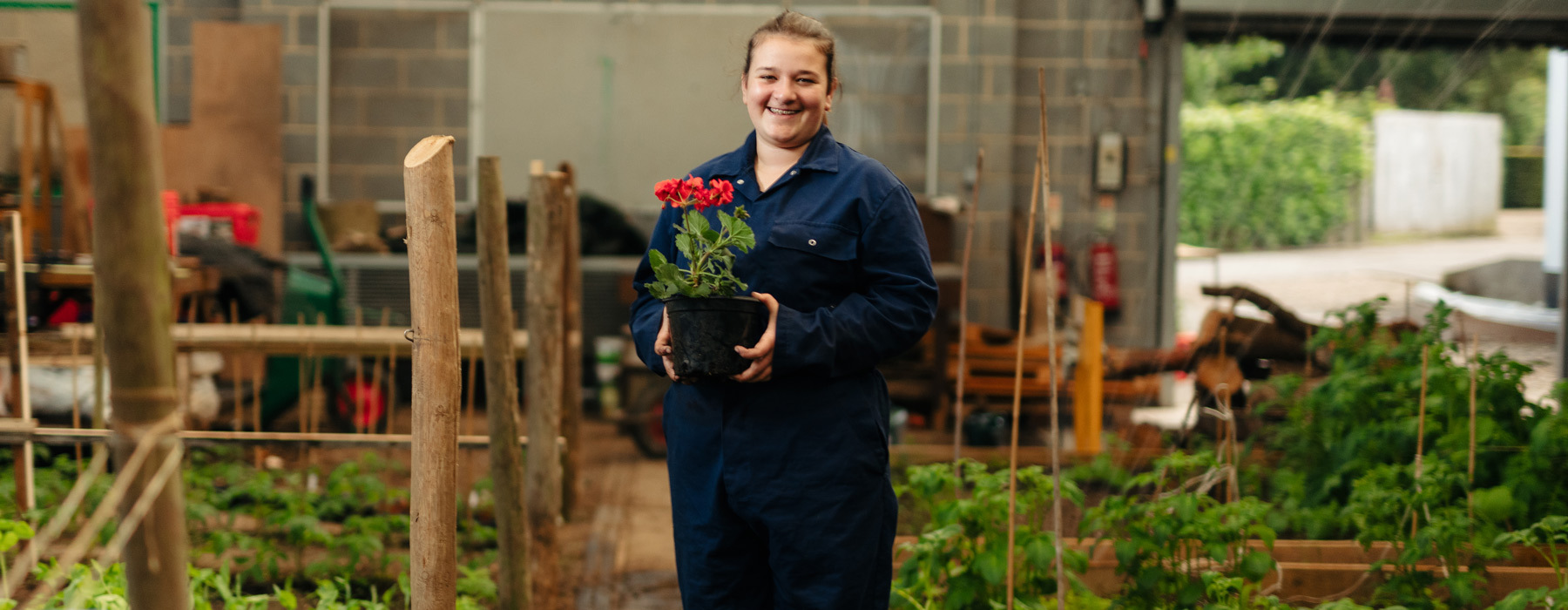 Foundation banner Student with flowers in horticulture unit at Bishop Burton College