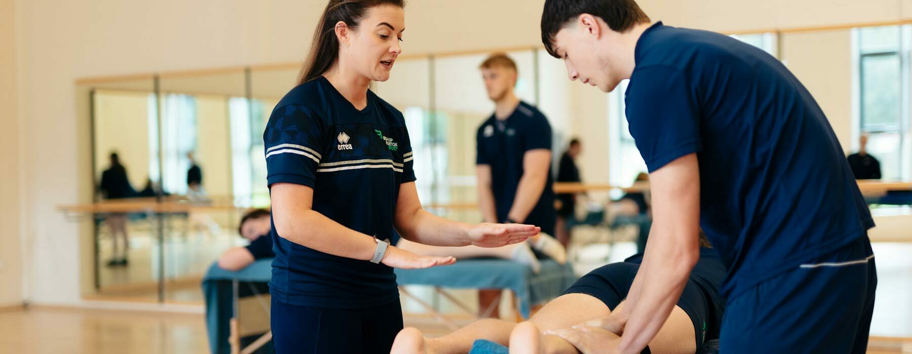 Sport banner Sports student trying out therapy techniques