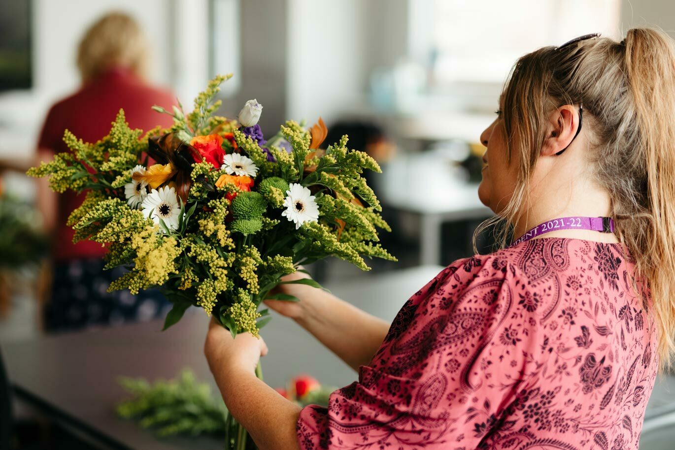 Floristry callout Degree student holding bouquet of flowers